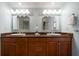 Bright bathroom features double sinks, marble countertop, and modern lighting at 5301 Gulf Blvd # C202, St Pete Beach, FL 33706