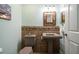 Charming powder room featuring decorative tile, vessel sink, and wall art at 5301 Gulf Blvd # C202, St Pete Beach, FL 33706