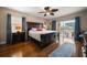 Bright bedroom with hardwood floors and a private balcony overlooking the outside resort at 5301 Gulf Blvd # C202, St Pete Beach, FL 33706