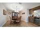 Comfortable dining area with bar area including a built-in wine cooler at 5301 Gulf Blvd # C202, St Pete Beach, FL 33706