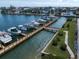 Waterfront property with private boat docks and lush landscaping along the canal at 5301 Gulf Blvd # C202, St Pete Beach, FL 33706