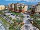 Upscale residential complex featuring multiple buildings, lush landscaping, and ample parking at 5301 Gulf Blvd # C202, St Pete Beach, FL 33706