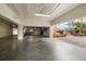 Open garage with storage shelves and access to the community area at 5301 Gulf Blvd # C202, St Pete Beach, FL 33706