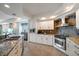 Modern kitchen features stainless steel appliances, granite countertops, tiled backsplash and ample cabinet space at 5301 Gulf Blvd # C202, St Pete Beach, FL 33706