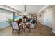 Open-concept living room featuring tile flooring, recessed lighting, and modern decor at 5301 Gulf Blvd # C202, St Pete Beach, FL 33706