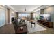 Bright living room with water views, comfortable seating, and access to outdoor patio area at 5301 Gulf Blvd # C202, St Pete Beach, FL 33706