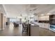 Bright and airy living space with a kitchen island and views of the patio at 5301 Gulf Blvd # C202, St Pete Beach, FL 33706