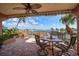 Beautiful covered patio featuring brick flooring and lovely water views at 5301 Gulf Blvd # C202, St Pete Beach, FL 33706