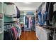 Spacious walk-in closet with custom shelving and ample storage space for clothing and accessories at 5301 Gulf Blvd # C202, St Pete Beach, FL 33706