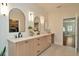 Luxurious bathroom showcasing dual sinks, ample counter space, and access to walk-in closet at 536 Ontario Ave, Crystal Beach, FL 34681