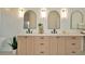 Elegant bathroom with dual sinks, neutral wood cabinetry, and modern finishes at 536 Ontario Ave, Crystal Beach, FL 34681