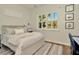 Bright bedroom with a cozy bed, plantation shutters, and natural light at 536 Ontario Ave, Crystal Beach, FL 34681
