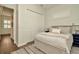 Cozy bedroom with closet and shuttered window, light colored walls and wood floor at 536 Ontario Ave, Crystal Beach, FL 34681
