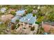 Charming waterfront home featuring lush landscaping, a brick driveway, and a bright, airy design at 536 Ontario Ave, Crystal Beach, FL 34681