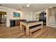 Large game room featuring a pool table, wet bar and access to utility room at 536 Ontario Ave, Crystal Beach, FL 34681