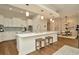 Open kitchen with an island, white cabinets, and stainless steel appliances at 536 Ontario Ave, Crystal Beach, FL 34681