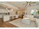 Open-concept living room flowing into a modern kitchen and dining area with hardwood floors at 536 Ontario Ave, Crystal Beach, FL 34681