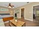 Inviting main bedroom featuring hardwood floors, ensuite bathroom, and a charming sitting area at 536 Ontario Ave, Crystal Beach, FL 34681