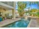 Inviting pool and patio area, perfect for relaxation and outdoor entertaining with tropical landscaping at 536 Ontario Ave, Crystal Beach, FL 34681