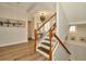 Elegant staircase with wooden railings and hardwood floors leading to the upper level at 536 Ontario Ave, Crystal Beach, FL 34681