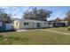 Beautiful one-story yellow home with a welcoming entrance and a well-manicured lawn at 636 41St Ne Ave, St Petersburg, FL 33703