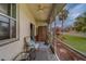 Relaxing screened porch features a ceiling fan and lovely views of the well manicured backyard at 6400 46Th N Ave # 37, Kenneth City, FL 33709