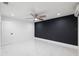 Modern bedroom featuring tile floors, ceiling fan, and modern lighting at 6508 Alta Monte Dr, Tampa, FL 33634