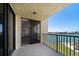 Condo balcony with railing and sliding glass door offering stunning waterfront views at 700 Island Way # 404, Clearwater Beach, FL 33767