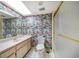 Bathroom with colorful wallpaper, and a glass shower at 700 Island Way # 404, Clearwater Beach, FL 33767