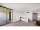 Cozy bedroom featuring a ceiling fan, closet, and access to a private balcony at 700 Island Way # 404, Clearwater Beach, FL 33767