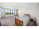 Bedroom with a large window and sliding glass door with a water view at 700 Island Way # 404, Clearwater Beach, FL 33767