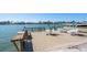 Outdoor waterfront deck with dining tables and chairs at 700 Island Way # 404, Clearwater Beach, FL 33767