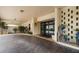 An inviting covered entrance showcases decorative brick, potted plants, and modern glass doors at 700 Island Way # 404, Clearwater Beach, FL 33767