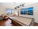 Game room with pool table, hanging lights, and bridge artwork on the wall at 700 Island Way # 404, Clearwater Beach, FL 33767