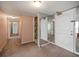 Hallway featuring mirrored doors, carpeted flooring, and neutral colored walls at 700 Island Way # 404, Clearwater Beach, FL 33767