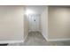 Hallway featuring tile flooring and a white front door at 700 Island Way # 404, Clearwater Beach, FL 33767