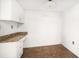 The area includes white cabinets and drawers with granite-style countertops at 700 Island Way # 404, Clearwater Beach, FL 33767
