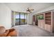 Inviting living room with a large sliding glass door, balcony, and built-in entertainment center at 700 Island Way # 404, Clearwater Beach, FL 33767