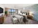 Stylish main bedroom with a private balcony overlooking the ocean and patterned accent wall at 700 Island Way # 404, Clearwater Beach, FL 33767