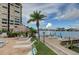 Beautiful poolside lounge area next to the bay with lounge chairs and covered picnic area at 700 Island Way # 404, Clearwater Beach, FL 33767