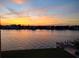 Beautiful sunset reflected on the water with silhouette of waterfront homes at 700 Island Way # 404, Clearwater Beach, FL 33767