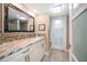 Bathroom featuring granite countertops, a modern vanity, and tiled floors at 74 Gulf Blvd # 2B, Indian Rocks Beach, FL 33785