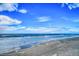 Picturesque view of the ocean and beach on a sunny day at 74 Gulf Blvd # 2B, Indian Rocks Beach, FL 33785