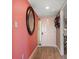 Inviting entryway featuring a stylish mirror, bright lighting, and a convenient spot for hanging hats at 74 Gulf Blvd # 2B, Indian Rocks Beach, FL 33785