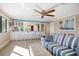 Inviting living space featuring a breakfast bar, ample seating, and natural light at 74 Gulf Blvd # 2B, Indian Rocks Beach, FL 33785