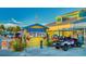 Quaint restaurant with golf cart and cheerful design featuring outdoor dining at 74 Gulf Blvd # 2B, Indian Rocks Beach, FL 33785