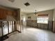 Open kitchen and dining area awaiting remodel with abundant light and tile floor at 817 61St Ne Ave, St Petersburg, FL 33703