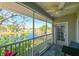 Scenic screened balcony with views of a serene lake, perfect for enjoying morning coffee or evening sunsets in peace at 8350 Savannah Trace Cir # 1808, Tampa, FL 33615