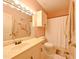 Neutral bathroom with a modern vanity, tile floors, storage cabinet, and shower at 8350 Savannah Trace Cir # 1808, Tampa, FL 33615