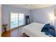 Comfortable bedroom featuring a ceiling fan, sliding glass doors, and relaxing light-purple colored walls at 8350 Savannah Trace Cir # 1808, Tampa, FL 33615